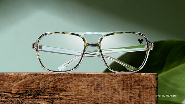 McAllister glasses on a wooden shelf with a VSP heart logo sticker in the corner of one of the lenses